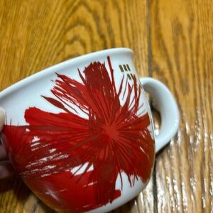 Starbucks 2014 red and gold Christmas poinsettia mug.  Great condition.
